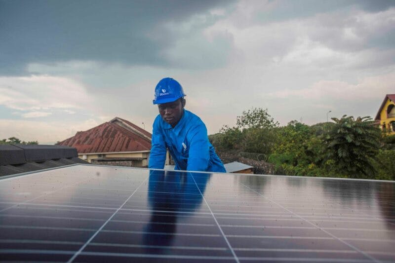 Engineer in PPE working on solar panel