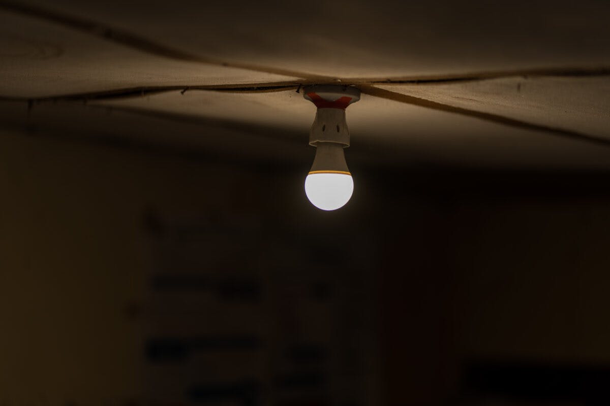 small lightbulb in dark room